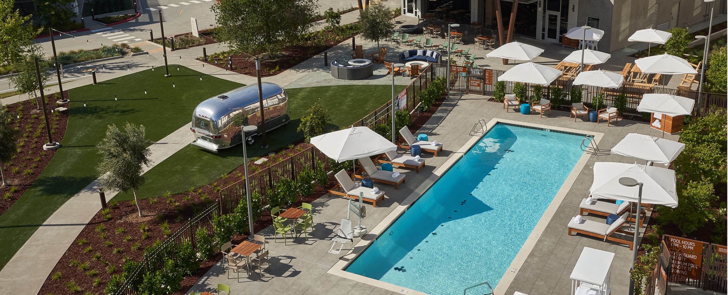 The Ameswell exterior with pool and Airstream Bar