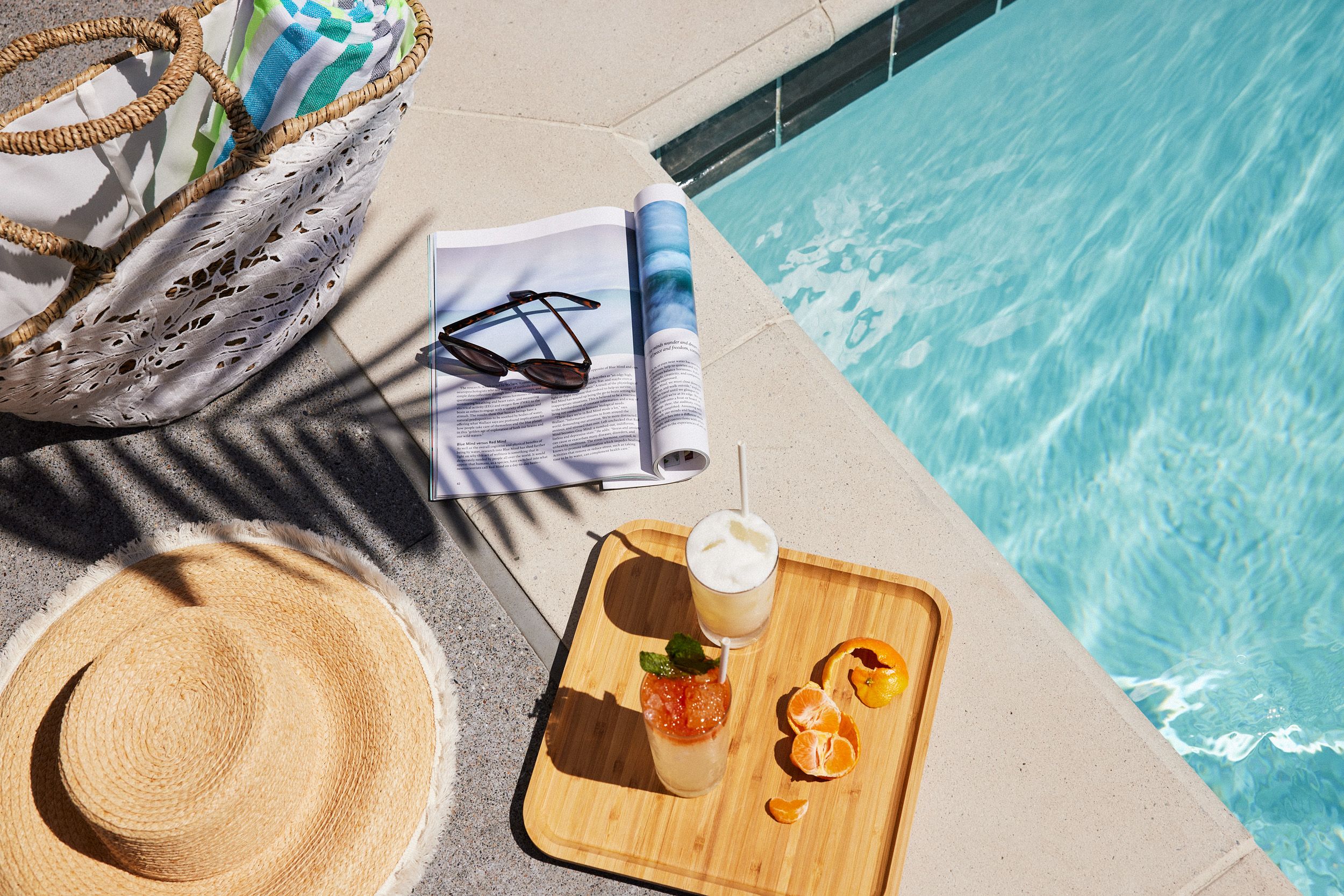 The pool at the Ameswell Hotel lit in the evening