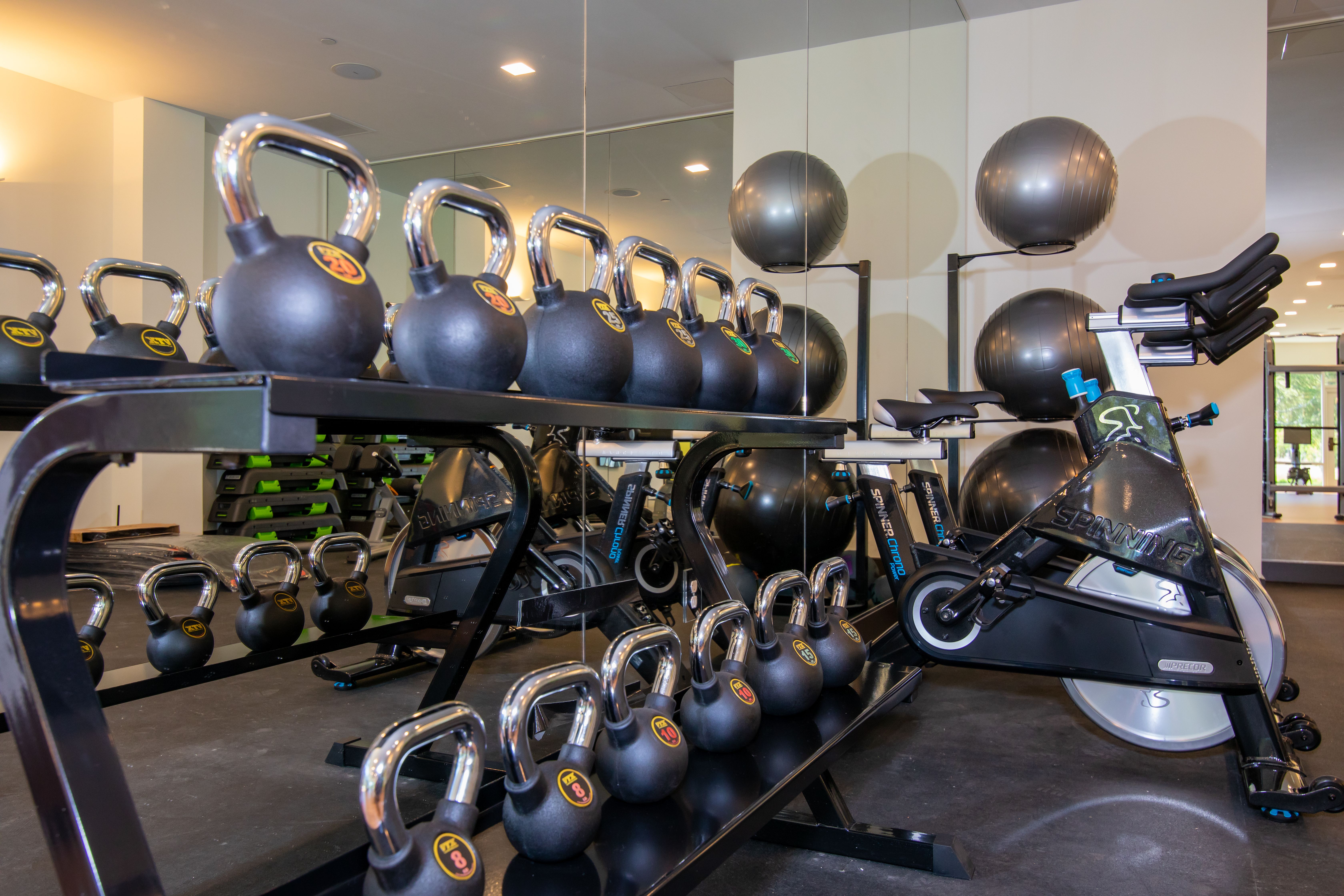 The pool at the Ameswell Hotel lit in the evening